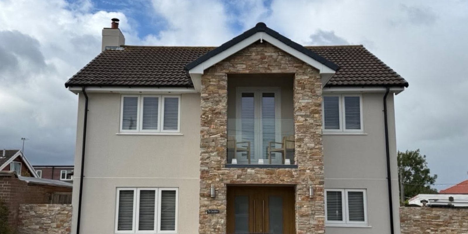 The house after Ecorend, finished in a soft stone colour